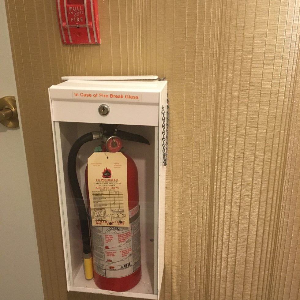 vancouver hilton fire extinguisher, fire extinguisher glass case, extinguisher glass casket