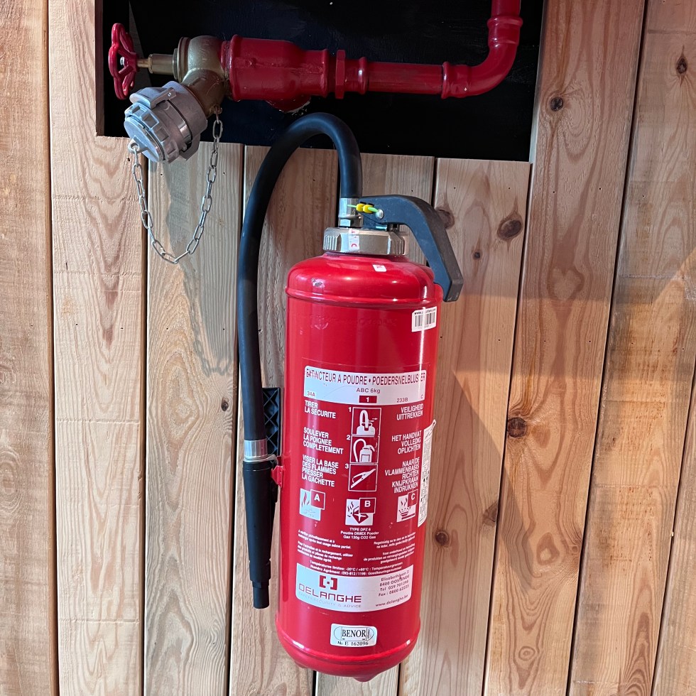 a Faucet and an extinguisher